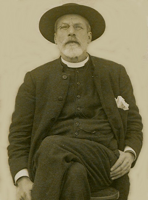Revd Dowding seated looking fierce